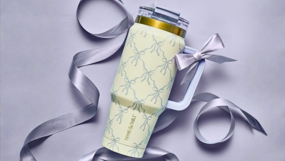 Don’t Miss Walmart’s NEW Thyme & Table Tumblers purple and white bow tumbler laying on a purple background