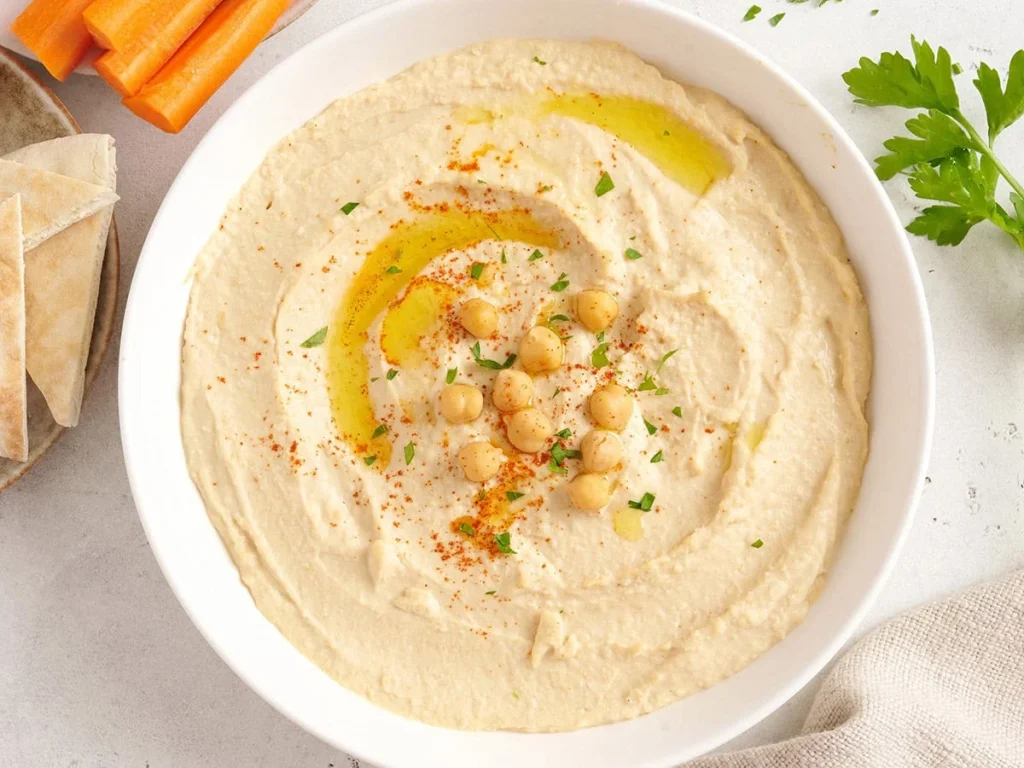 Overhead view of a bowl of homemade hummus.