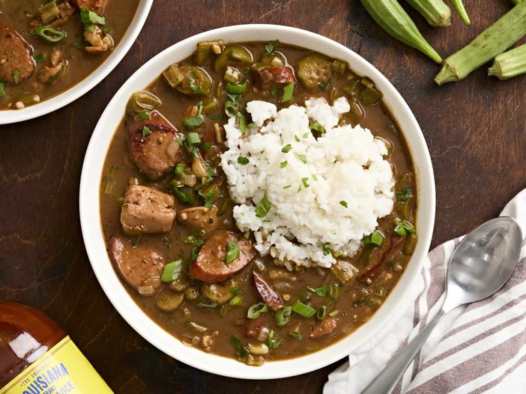 Overhead view of a bowl of gumbo and rice.