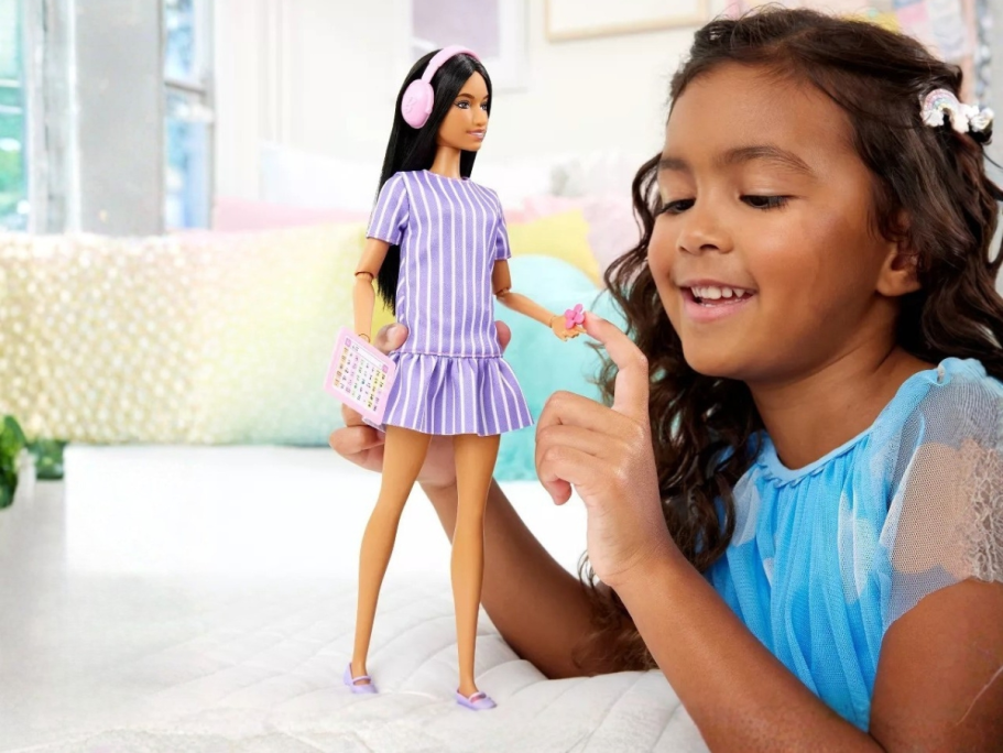 NEW Austitic Barbie Doll Only $10.99 on Target.com (Includes Headphones, Fidget Spinner, & Tablet) little girl playing an Autistic Barbie Fashionista Doll and accessories