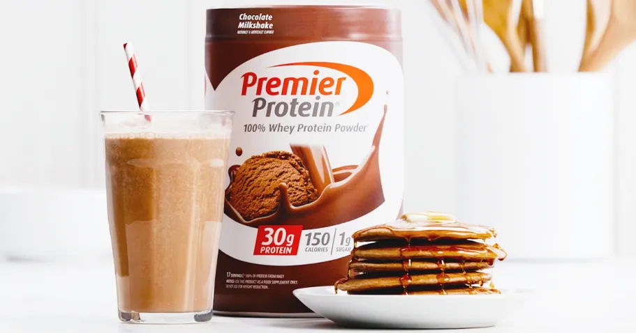 Premier Protein Powder Just $18 Shipped on Amazon (Reg. $28) container of Premier Protein Powder with glass of chocolate milk and stack of chocolate pancakes