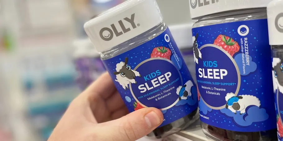 OLLY Kids Sleep Gummies 60-Count Just $9.68 Shipped w/ Stackable Amazon Savings hand taking olly kids sleep gummies off shelf