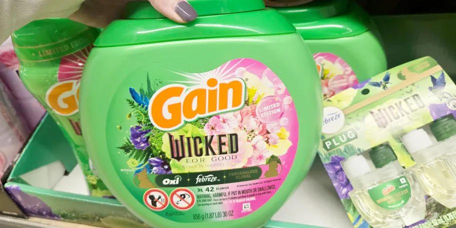 Score 45% Off Gain Laundry Detergent on Amazon hand reaching for gain wicked flings container