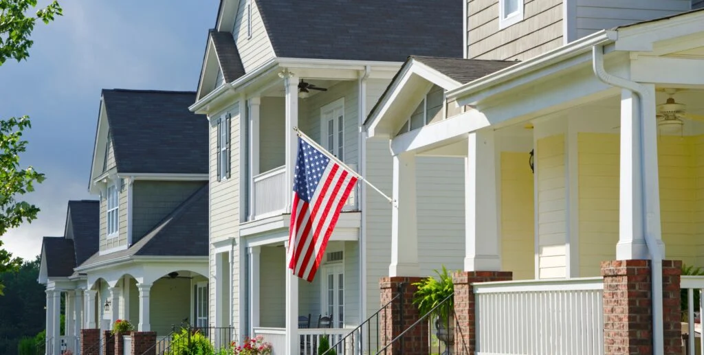 Trump Floats Personal Residence Depreciation—A Big Move That Can Unlock Savings For Investors american flag hanging from home