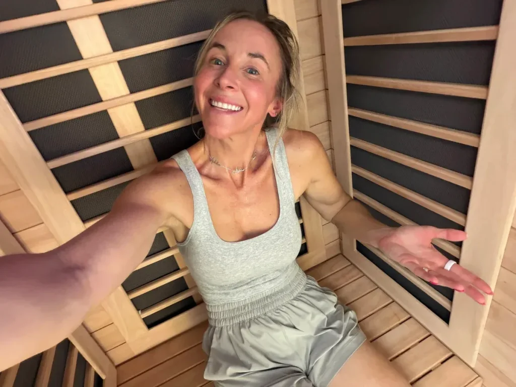 woman sitting inside sauna