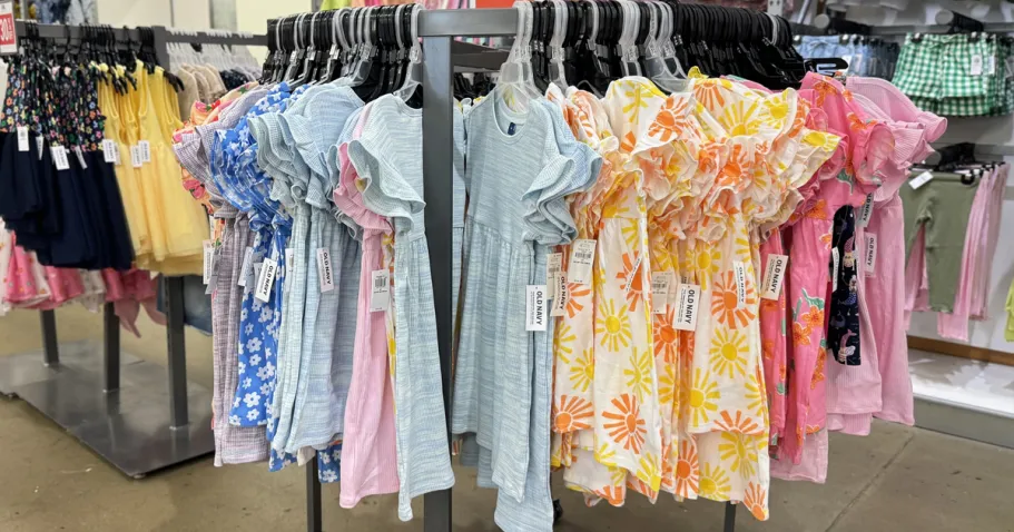 50% Off Old Navy Dresses | Styles from $8.49 store display rack full of girls dresses on hangers