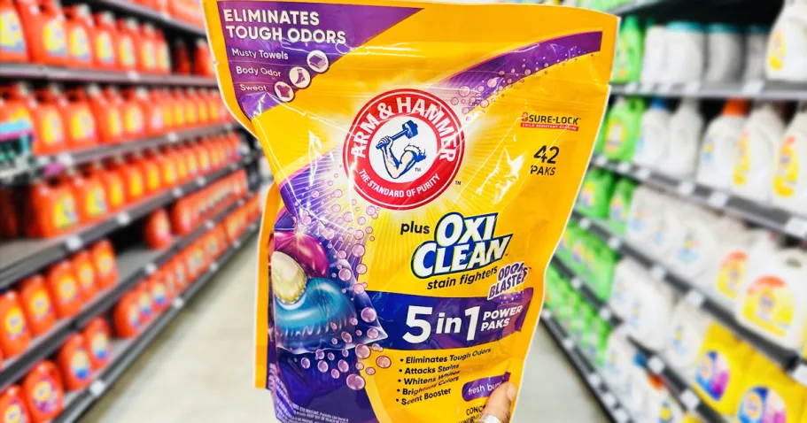 Arm & Hammer Power Paks 42-Count Just $5.66 Shipped on Amazon (Reg. $10) hand holding up a bag of Arm & Hammer Laundry Detergent Paks in store