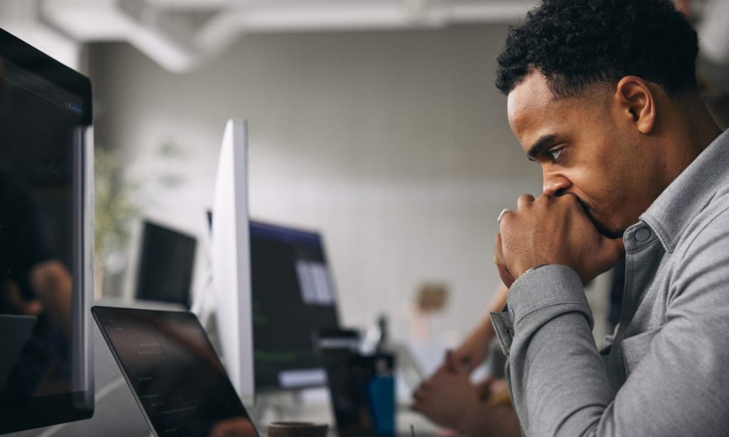 Can a Financial Advisor Manage Your 401(k)? Person at computer