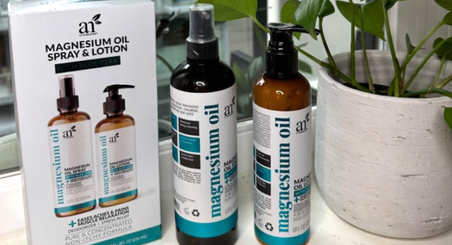 Magnesium Oil Spray AND Lotion Set Only $9.99 Shipped on Amazon (Reg. $15) ArtNaturals Magnesium Oil spray and lotion bottles with their box on a windowsill near a plant