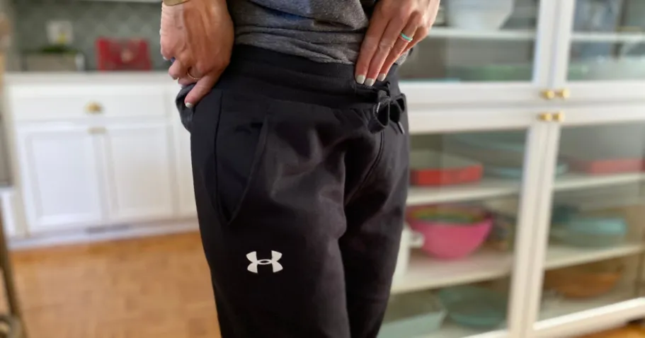 Under Armour Pants & Joggers from $10 (Regularly $32) person wearing black under armour pants