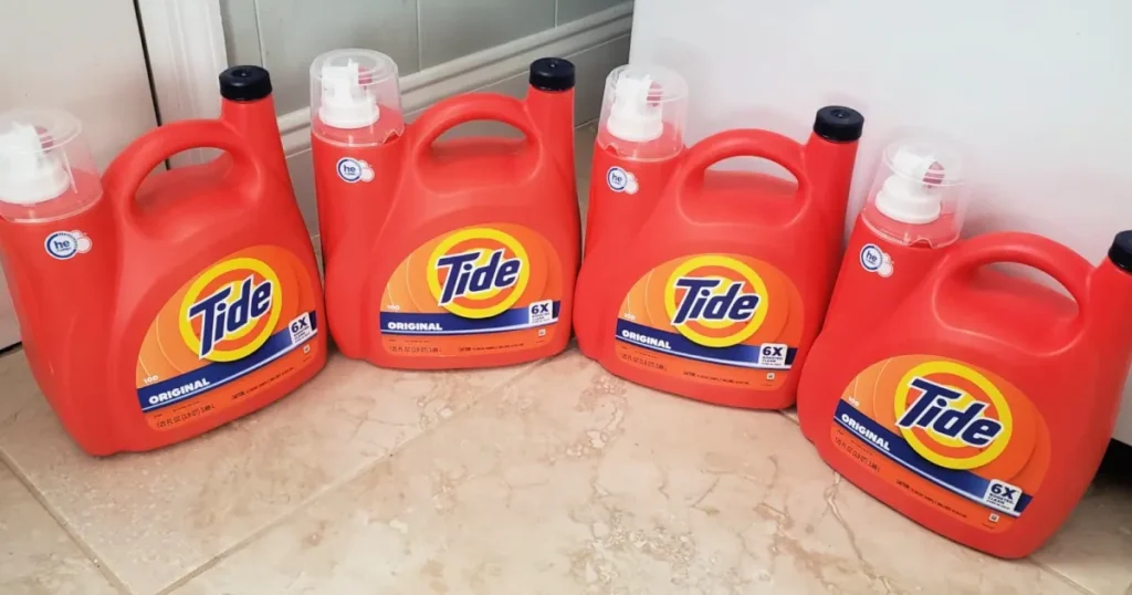 large bottles of tide detergent on floor