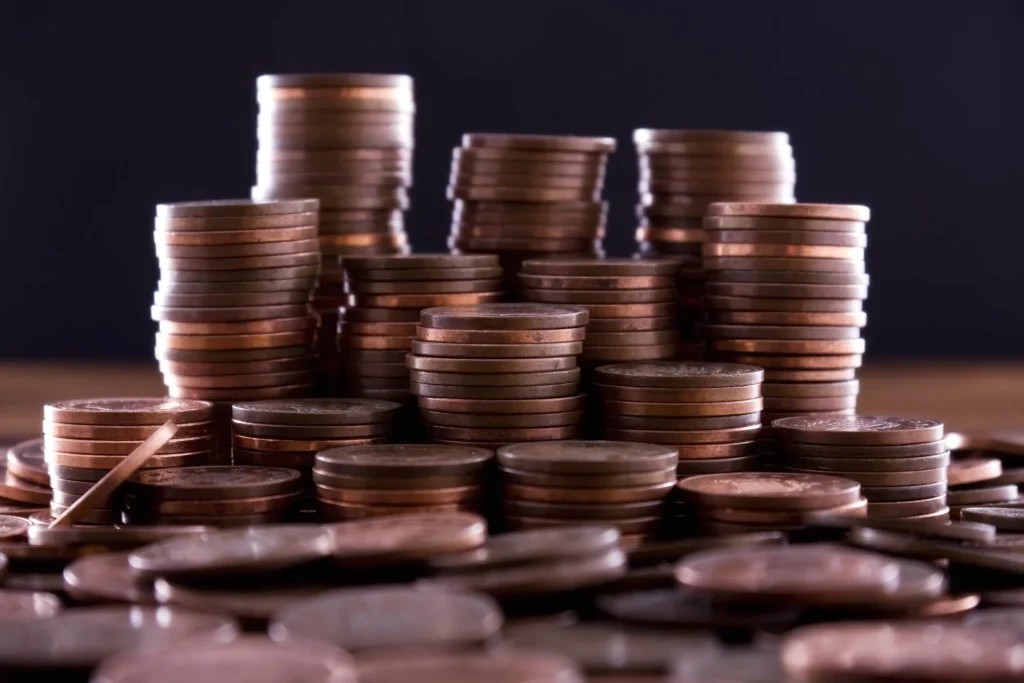 1 Million Dollars or A Penny Doubled Every Day for 30 Days? Pile of pennies showing exponential growth from compounding interest