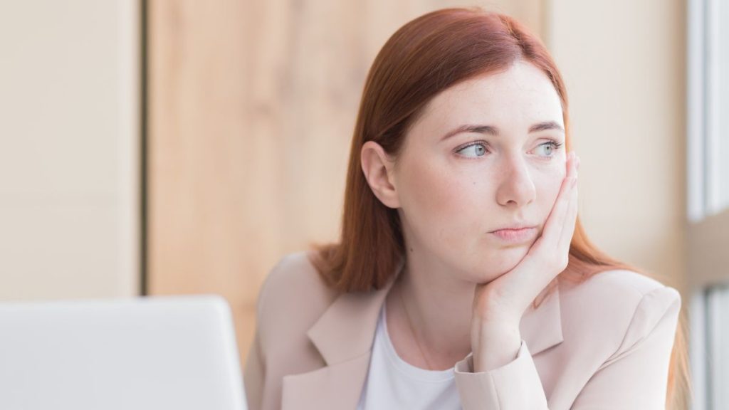 Working Woman Thinking Looking At The Side Hand On Cheek