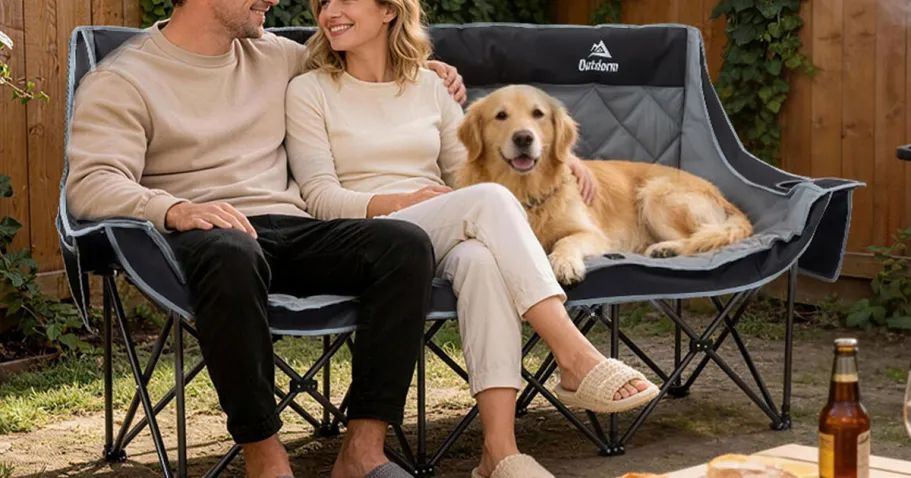 3-Person Camping Chair w/ Cupholders & Storage Pockets on Amazon (Price Drop!) man, woman, and dog sitting on 3-person camping chair