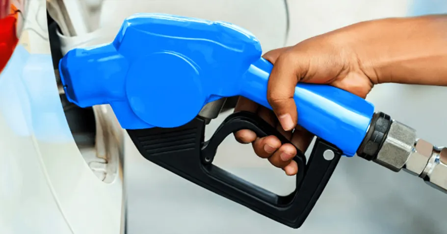 30 Best Amazon Prime Member Benefits We Love person holding a blue gas pump nozzle in their gas tank