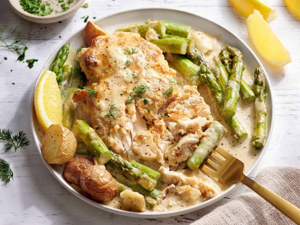 Creamy Asparagus Chicken – Budget Bytes Side view of creamy asparagus chicken on a plate with a fork.