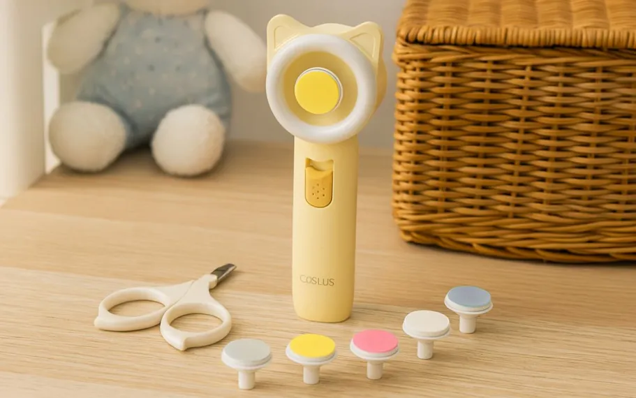 Electric Baby Nail Trimmer w/ Ring Light Only $2.99 on Amazon (Baby Shower Gift) image of COSLUS Electric Baby Nail Trimmer with items displayed on top of the table