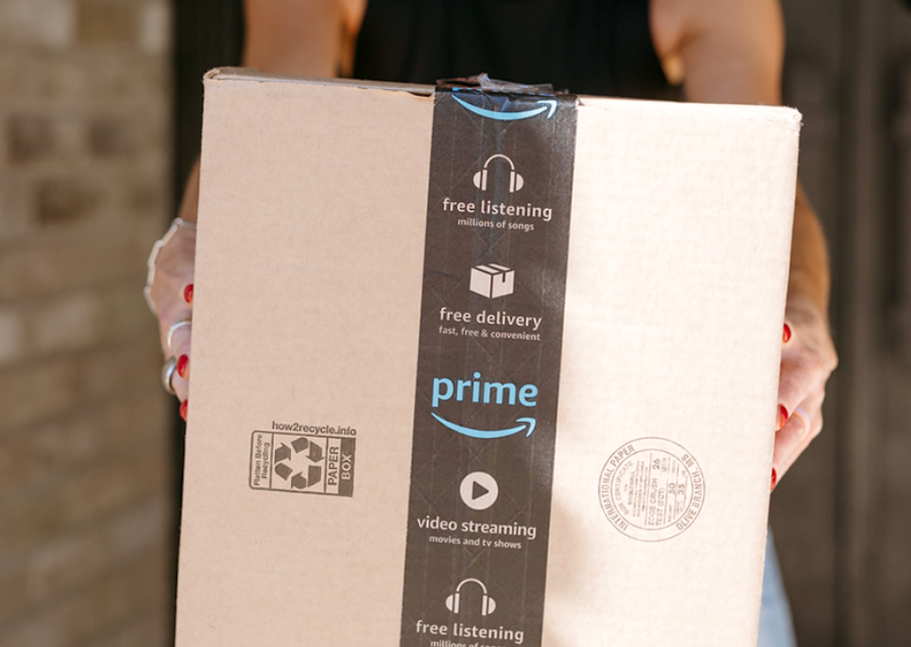 How to Get an Amazon Prime Access Membership Discount person holding an Amazon shipping box