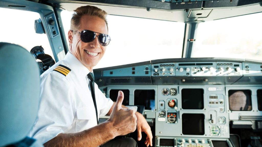 Pilot In Airplane Cabin Giving Thumbs Up MSN