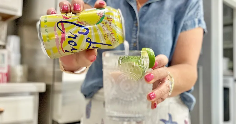 LaCroix Sparkling Water 8-Pack Only $3 on Amazon woman pouring a can of LaCroix into a glass with ice