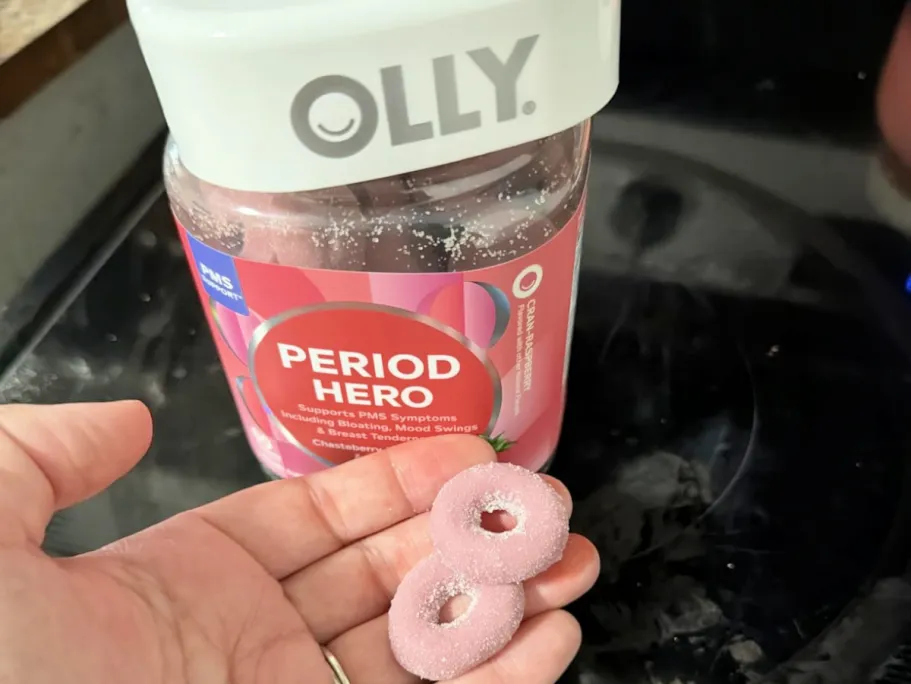 OLLY Women’s Vitamins from $6 Shipped on Amazon (Reg. $16) OLLY period hero gummies bottle and gummies in hand