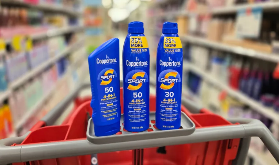 Coppertone Sunscreen from $6.89 at Target + Free $5 Gift Card When You Stock Up! three coppertone sport sunscreens lined up on a target cart in store