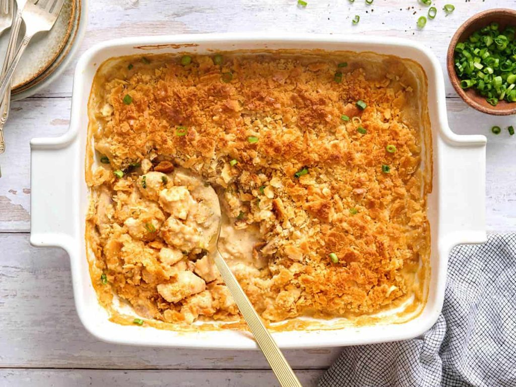 Million Dollar Chicken Casserole – Budget Bytes Overhead view of a million dollar chicken casserole in a casserole dish with a spoon.