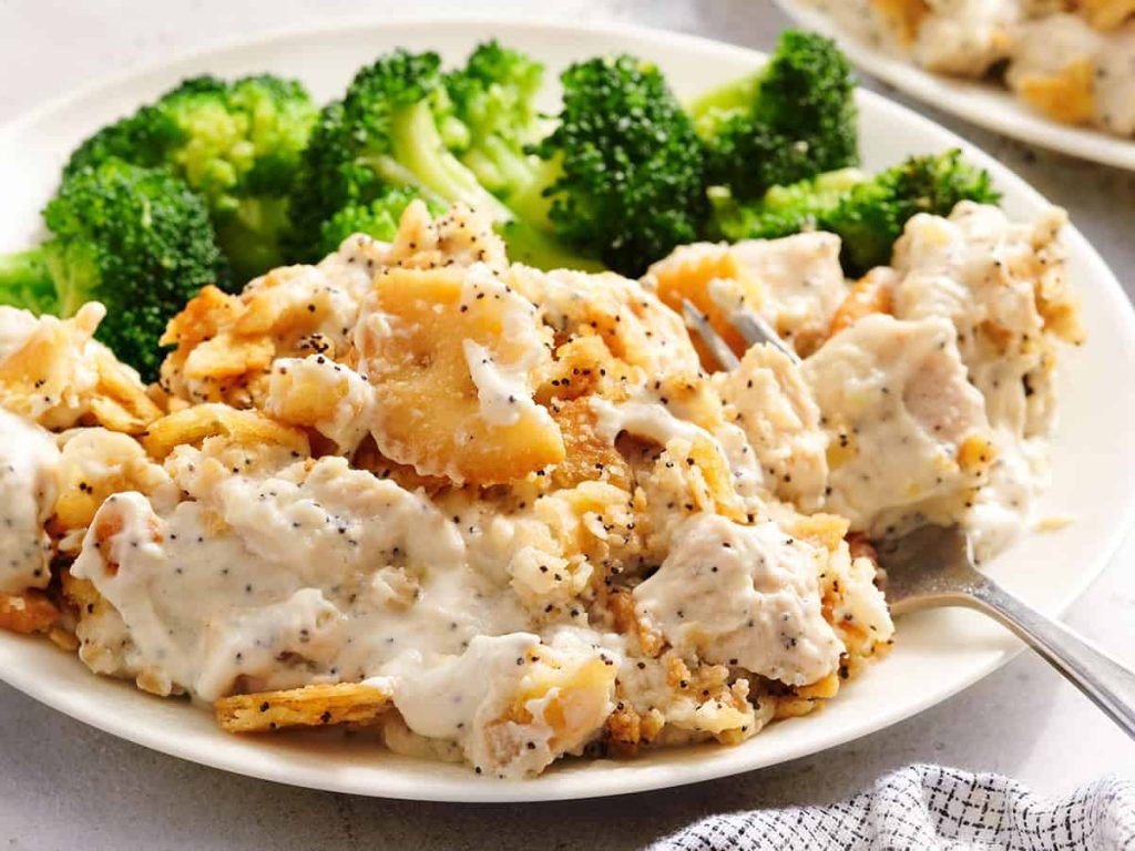Poppy Seed Chicken – Budget Bytes Side view of poppy seed casserole on a plate with broccoli.