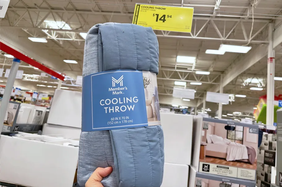 Sam’s Club Cooling Throws Just $14.94 (Perfect for Summer!) hand holding up a blue Member