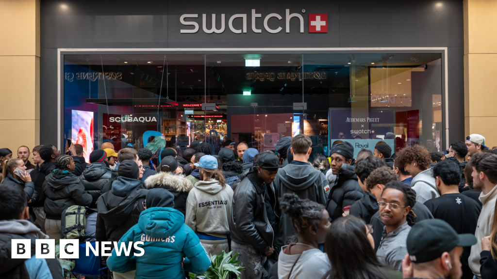 Swatch shuts stores after crowds queue for new watch Swatch shuts stores after crowds queue for new watch
