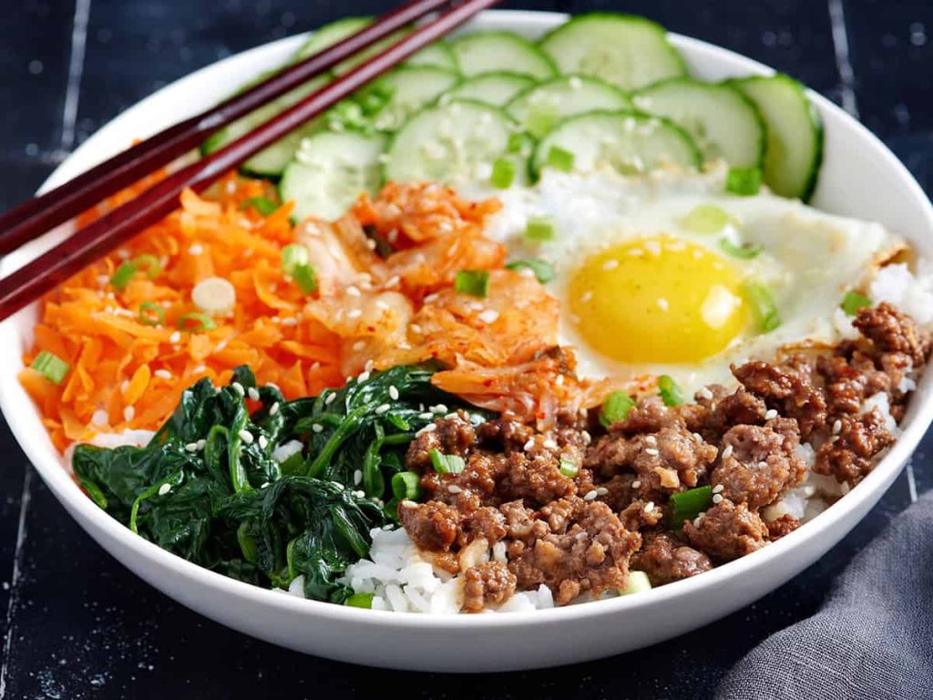 Side view of a bibimbap bowl. 