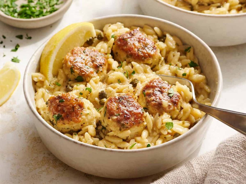 Chicken Piccata Meatballs and Orzo Skillet Chicken piccata meatballs and orzo in a bowl.